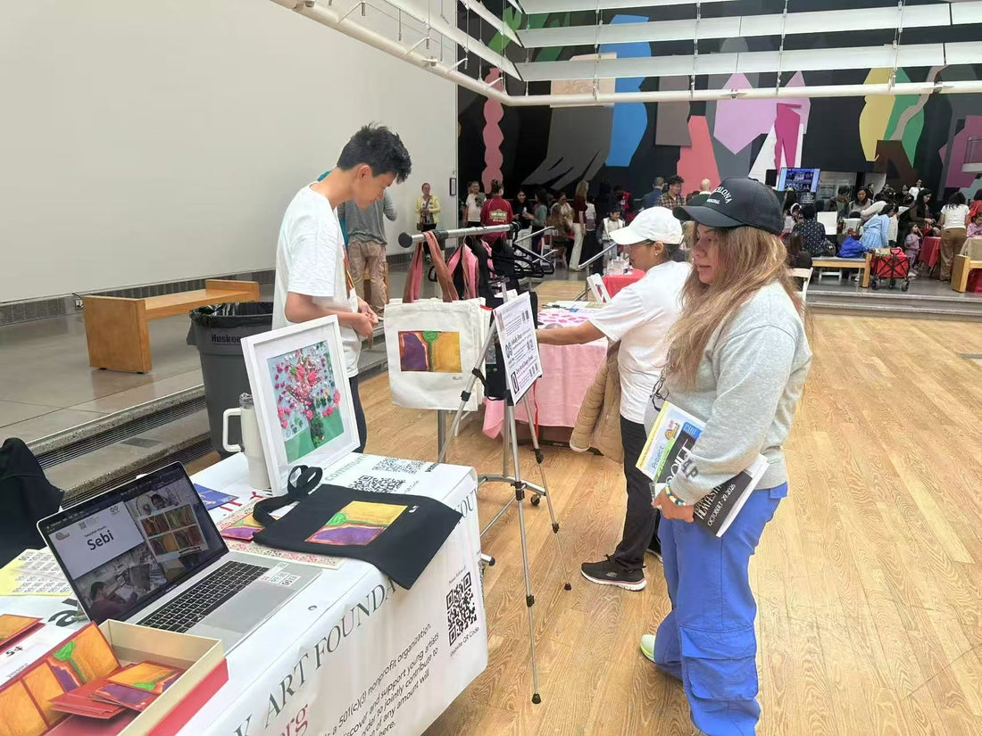 Visitors at the New York Art Foundation for Youth and Initially Shop table at the Queens Museum